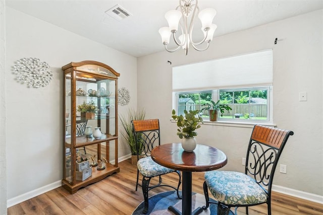 1726 Caddell Ln, Norman, OK 73069 - dining room featuring wood finished floors and a chandelier