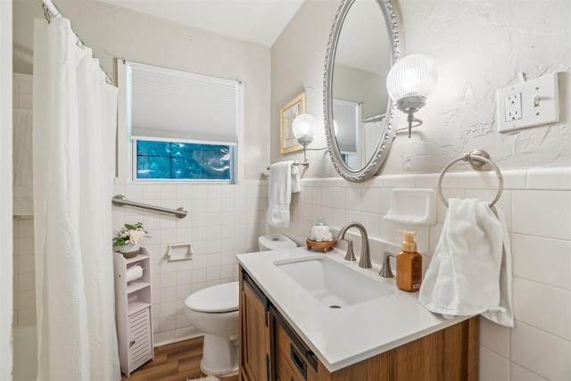 1726 Caddell Ln, Norman, OK 73069 - bathroom with vanity, tile walls, wood finished floors, a shower with curtain, and wainscoting