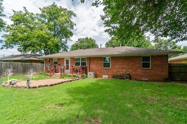 1726 Caddell Ln, Norman, OK 73069 - back of property featuring a fenced backyard, a wooden deck, brick siding, and crawl space