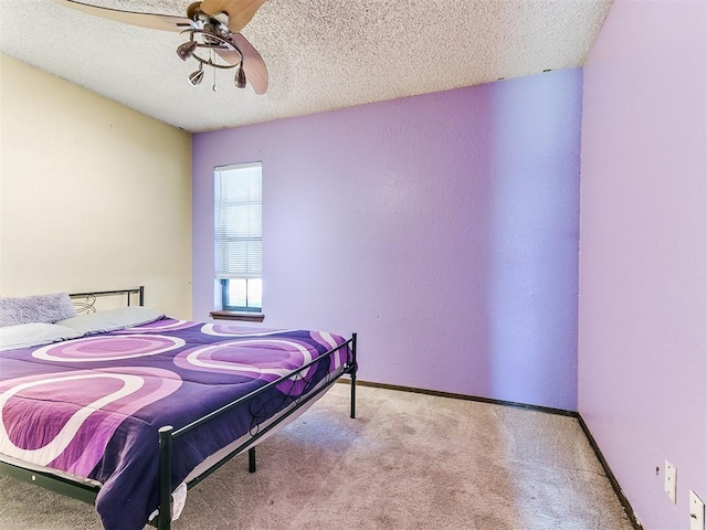 1916 Twin Tree Dr, Norman, OK 73071 - carpeted bedroom featuring a textured ceiling and ceiling fan