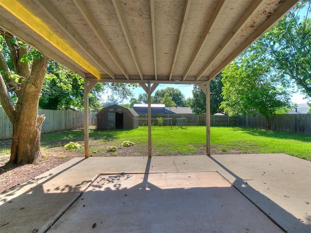 1916 Twin Tree Dr, Norman, OK 73071 - fenced backyard with a patio area and a storage shed