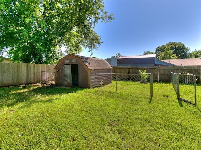 1916 Twin Tree Dr, Norman, OK 73071 - fenced backyard featuring a storage unit