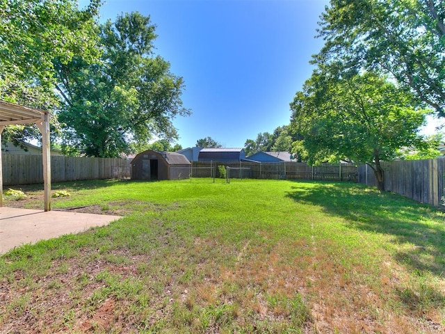 1916 Twin Tree Dr, Norman, OK 73071 - fenced backyard with a storage shed and a patio area