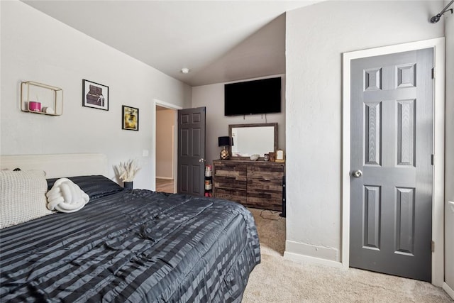 334 SE 24th St, Oklahoma City, OK 73129 - carpeted bedroom featuring baseboards and vaulted ceiling