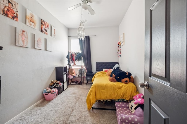 334 SE 24th St, Oklahoma City, OK 73129 - carpeted bedroom featuring ceiling fan and a chandelier