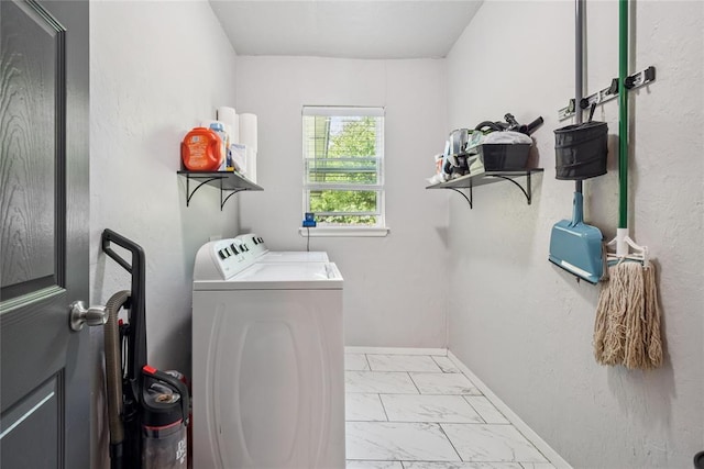 334 SE 24th St, Oklahoma City, OK 73129 - laundry room featuring washer and dryer and light marble finish floors