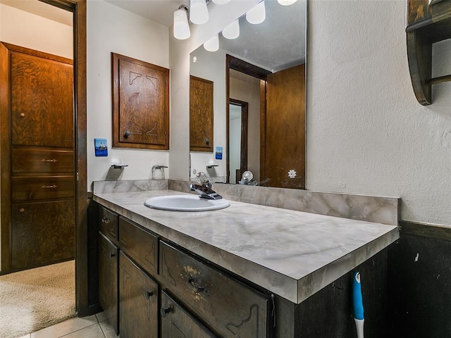 2120 N Divis Ave, Bethany, OK 73008 - bathroom featuring vanity, a textured wall, and tile patterned flooring