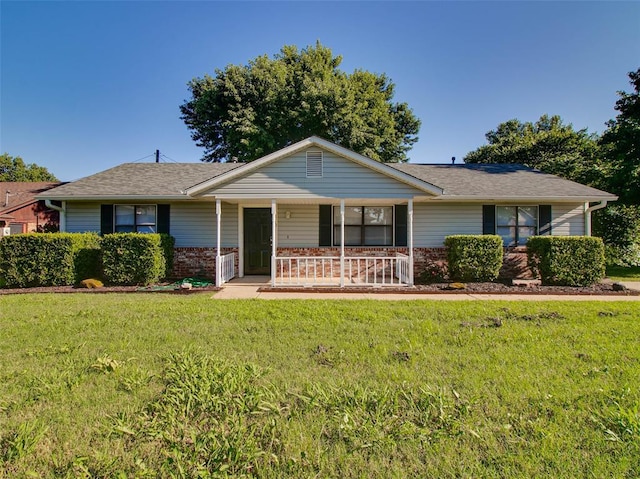 1810 Spring Ave, Stroud, OK 74079 - single story home with a porch, a front yard, brick siding, and roof with shingles