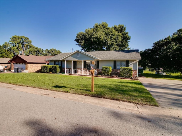 1810 Spring Ave, Stroud, OK 74079 - view of front of property with a porch, a front lawn, and driveway