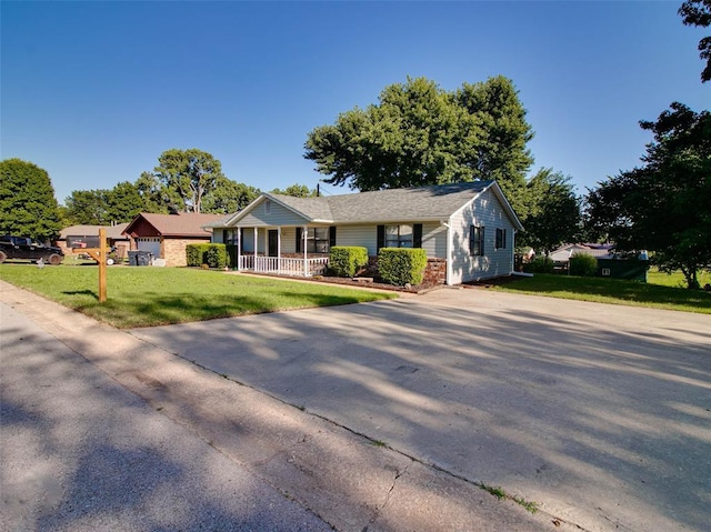 1810 Spring Ave, Stroud, OK 74079 - view of front of property with covered porch and a front yard