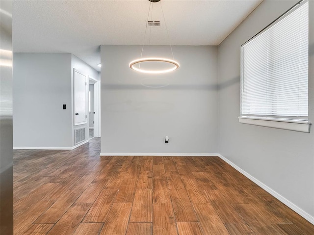 1810 Spring Ave, Stroud, OK 74079 - unfurnished room with wood finished floors