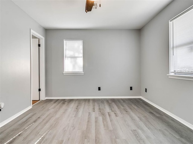 1810 Spring Ave, Stroud, OK 74079 - spare room with wood finished floors and baseboards
