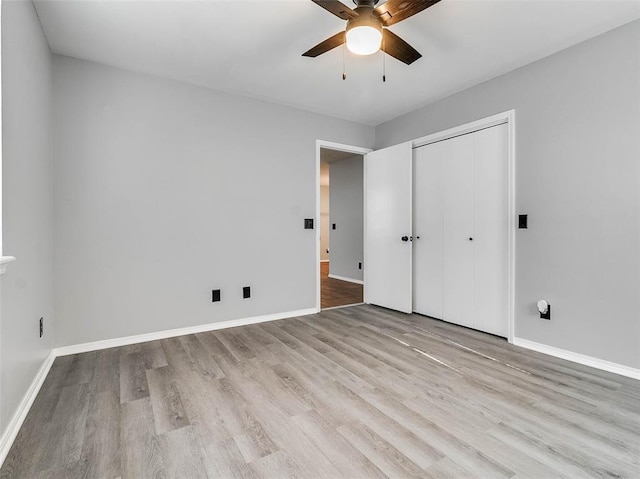 1810 Spring Ave, Stroud, OK 74079 - unfurnished bedroom featuring wood finished floors, a closet, and a ceiling fan