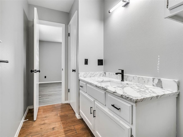 1810 Spring Ave, Stroud, OK 74079 - bathroom with wood finished floors and vanity