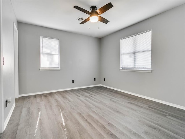 1810 Spring Ave, Stroud, OK 74079 - unfurnished room featuring healthy amount of natural light, wood finished floors, and ceiling fan