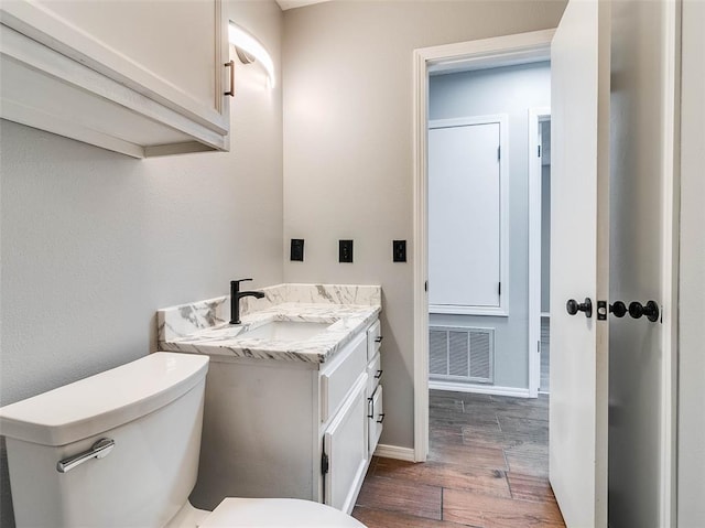 1810 Spring Ave, Stroud, OK 74079 - half bath featuring wood finished floors and vanity