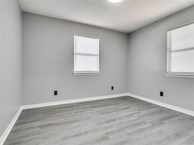 1810 Spring Ave, Stroud, OK 74079 - unfurnished room featuring a textured ceiling and wood finished floors