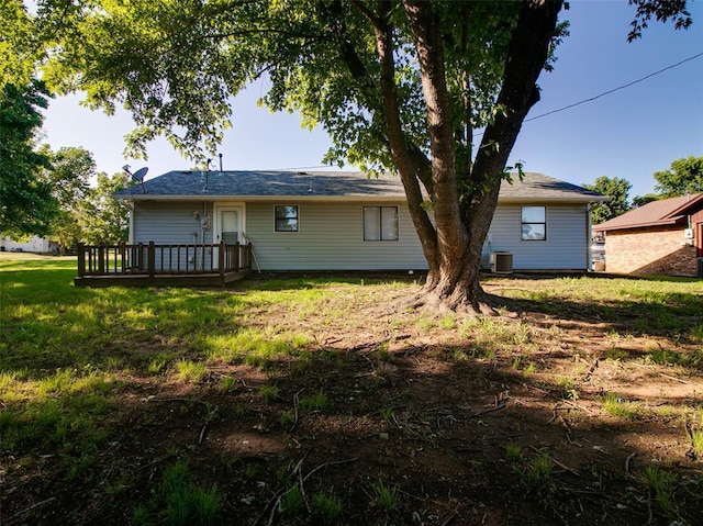 1810 Spring Ave, Stroud, OK 74079 - back of property featuring a wooden deck and a yard