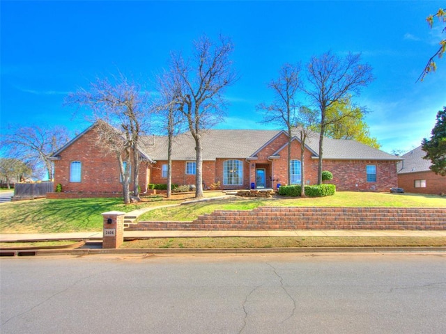 2404 Pawnee Xing, Edmond, OK 73034 - ranch-style home featuring brick siding