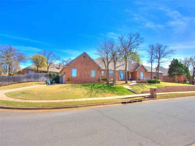 2404 Pawnee Xing, Edmond, OK 73034 - view of front facade featuring brick siding