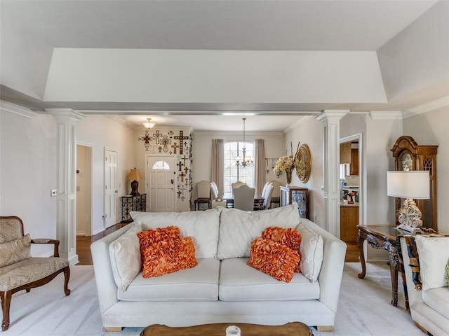 2404 Pawnee Xing, Edmond, OK 73034 - living room with decorative columns, ornamental molding, and light carpet