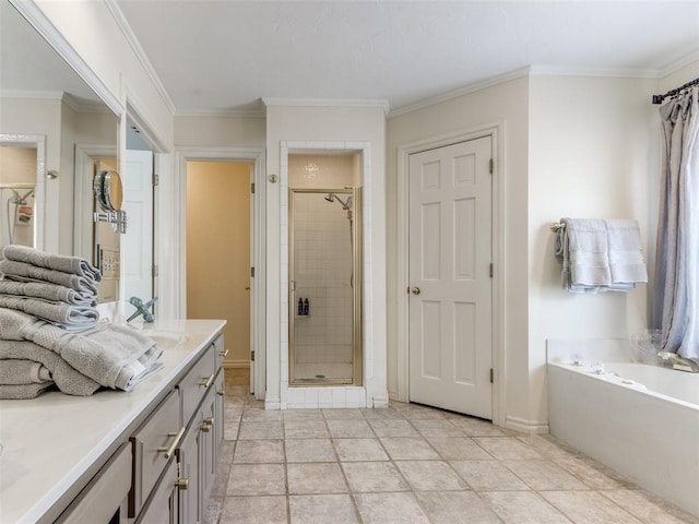 2404 Pawnee Xing, Edmond, OK 73034 - bathroom featuring vanity, a shower stall, ornamental molding, and a garden tub