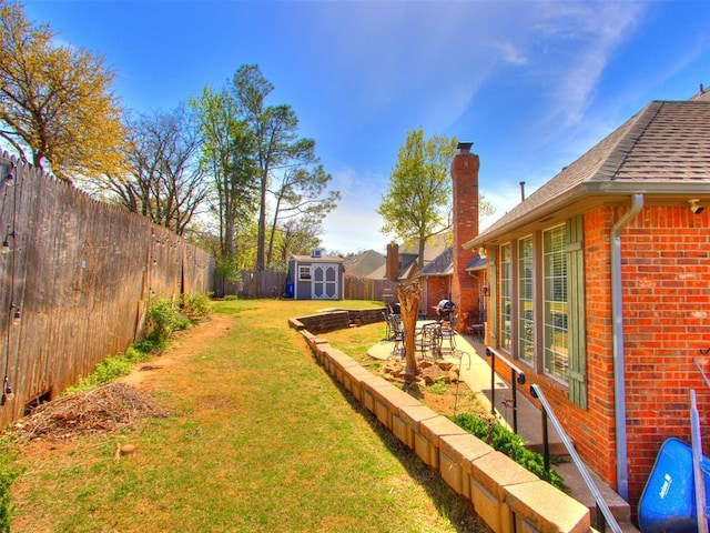 2404 Pawnee Xing, Edmond, OK 73034 - fenced backyard with a storage unit and a patio area
