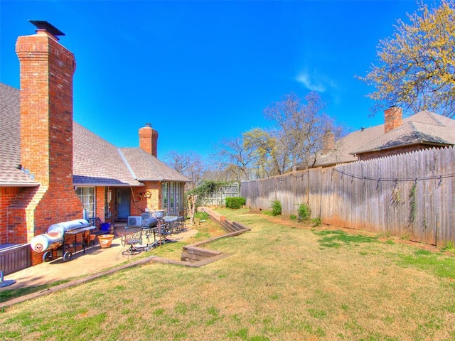 2404 Pawnee Xing, Edmond, OK 73034 - fenced backyard with a patio