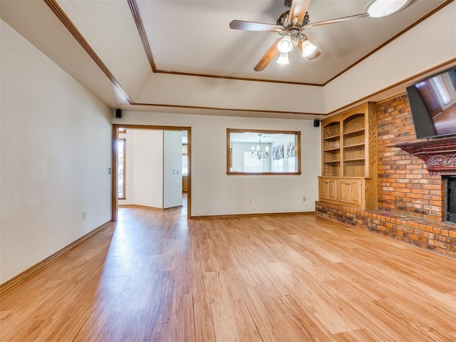 1917 Goldenrod Ln, Midwest City, OK 73130 - unfurnished living room with light wood finished floors, a fireplace, ornamental molding, plenty of natural light, and a ceiling fan