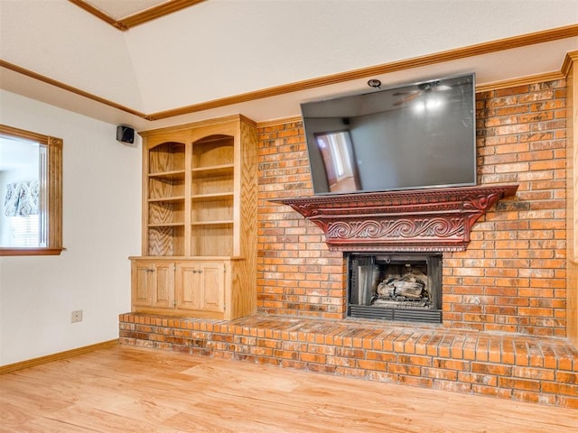 1917 Goldenrod Ln, Midwest City, OK 73130 - unfurnished living room featuring a brick fireplace, ornamental molding, wood finished floors, and vaulted ceiling