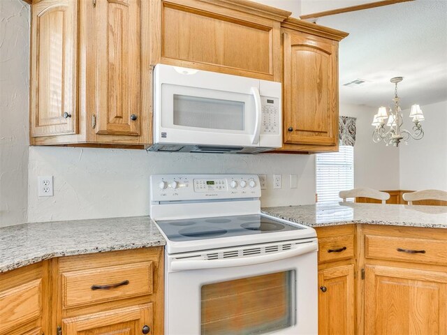 1917 Goldenrod Ln, Midwest City, OK 73130 - kitchen with white appliances, a chandelier, light stone countertops, and pendant lighting