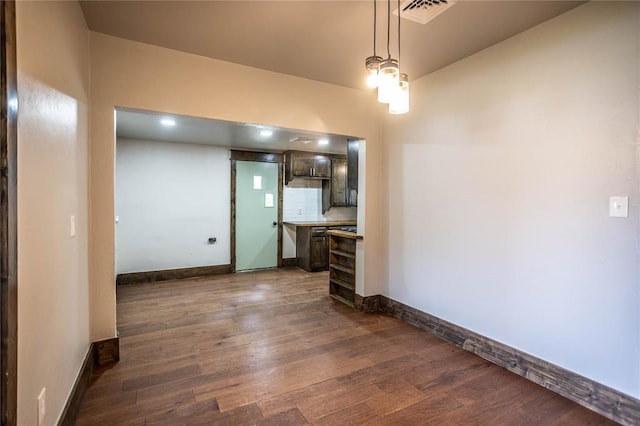 103 E Ash St, Carnegie, OK 73015 - unfurnished living room with dark wood finished floors