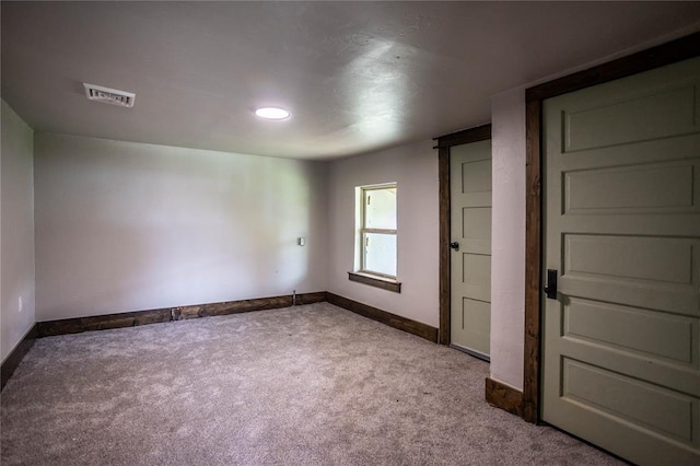 103 E Ash St, Carnegie, OK 73015 - carpeted empty room featuring baseboards
