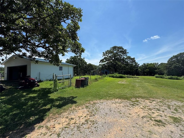 12237 N 359th Rd, Seminole, OK 74868 - view of yard featuring an outbuilding and a detached garage