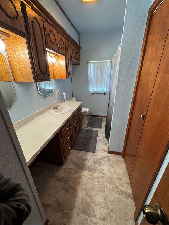 12237 N 359th Rd, Seminole, OK 74868 - bathroom featuring vanity and curtained shower