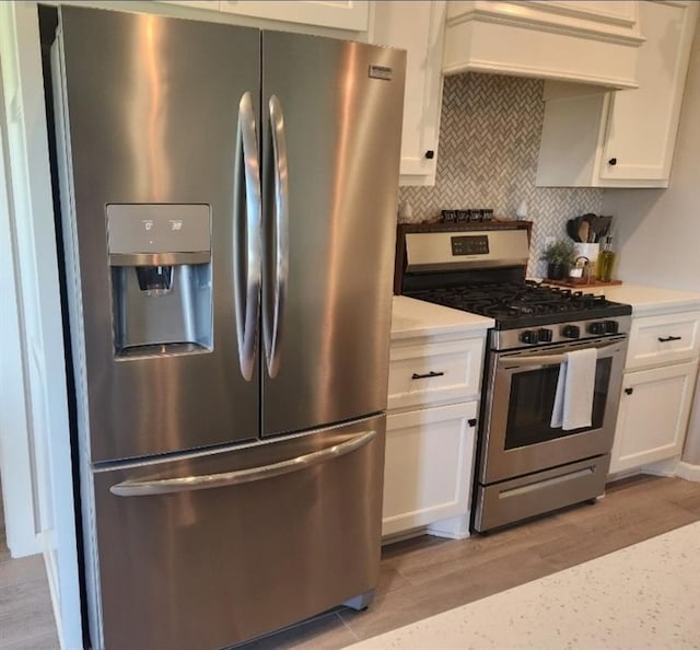 10812 NW 5th St, Yukon, OK 73099 - kitchen with appliances with stainless steel finishes, custom range hood, and white cabinets