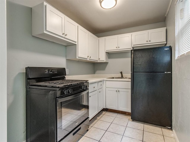 506 SW 24th St, Oklahoma City, OK 73109 - kitchen featuring black appliances, white cabinets, and light countertops