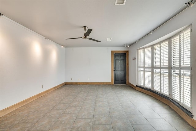 2527 NW 62nd St Unit 214, Oklahoma City, OK 73112 - spare room with ceiling fan and light tile patterned flooring