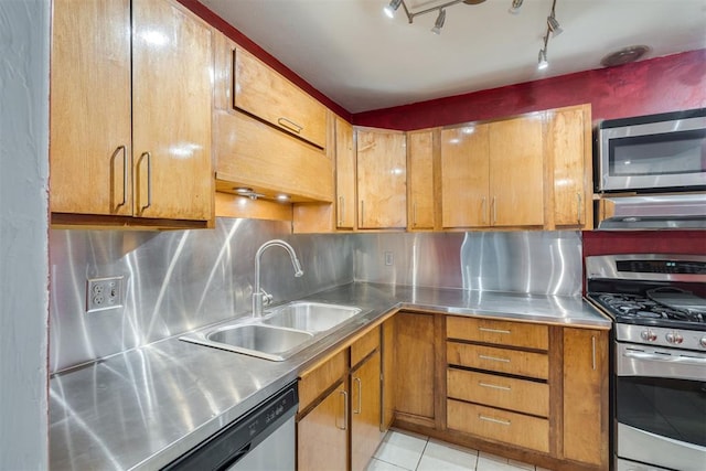2527 NW 62nd St Unit 214, Oklahoma City, OK 73112 - kitchen with stainless steel countertops, stainless steel appliances, ventilation hood, and brown cabinetry