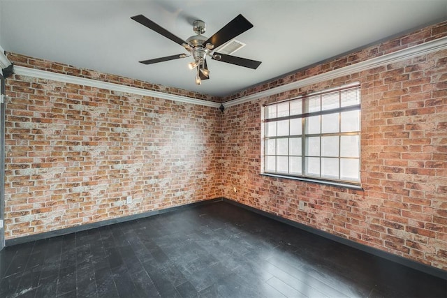2527 NW 62nd St Unit 214, Oklahoma City, OK 73112 - empty room with a ceiling fan, hardwood / wood-style flooring, and brick wall