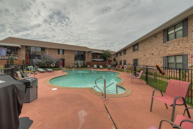 2527 NW 62nd St Unit 214, Oklahoma City, OK 73112 - community pool with a patio