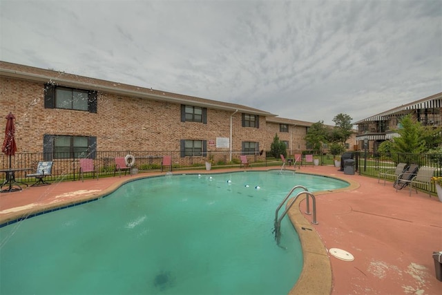 2527 NW 62nd St Unit 214, Oklahoma City, OK 73112 - community pool featuring a patio