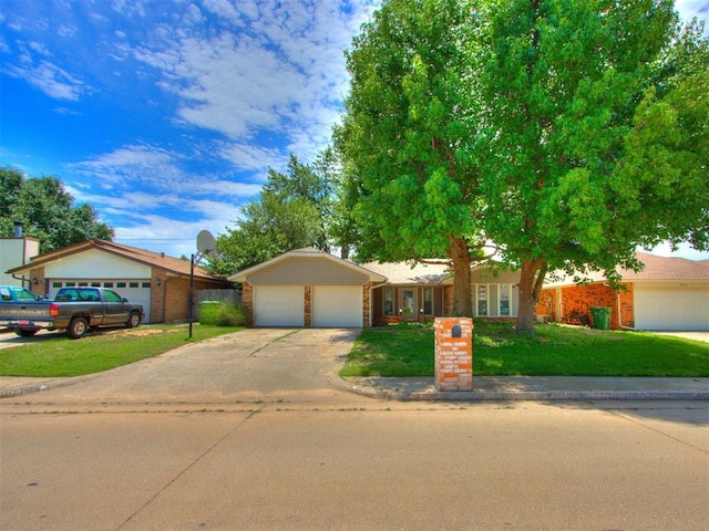 804 Royal Ln, Yukon, OK 73099 - single story home with a garage, driveway, a front lawn, and brick siding
