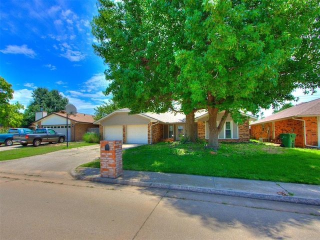 804 Royal Ln, Yukon, OK 73099 - ranch-style house with a front yard, an attached garage, and driveway