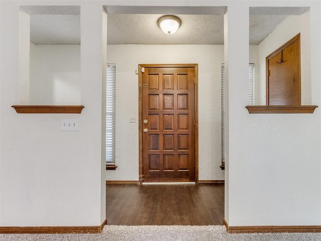 804 Royal Ln, Yukon, OK 73099 - entrance foyer featuring wood finished floors and a textured ceiling