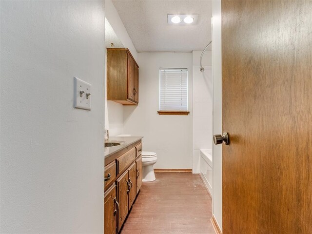 804 Royal Ln, Yukon, OK 73099 - bathroom with vanity, wood finished floors, and bathtub / shower combination