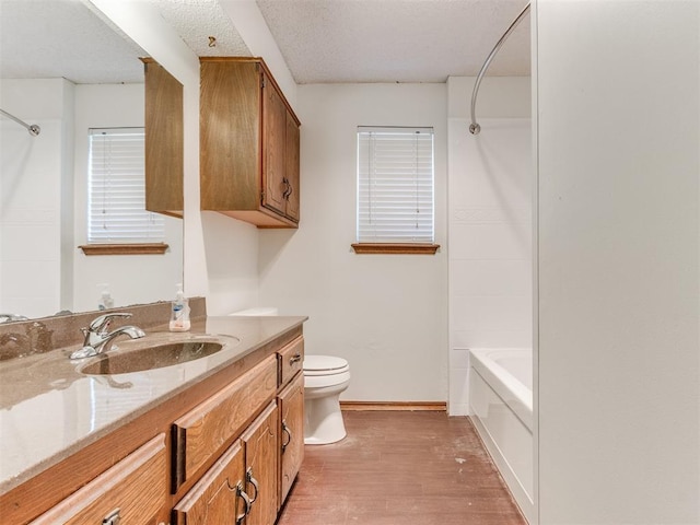 804 Royal Ln, Yukon, OK 73099 - bathroom with vanity, wood finished floors, and tub / shower combination