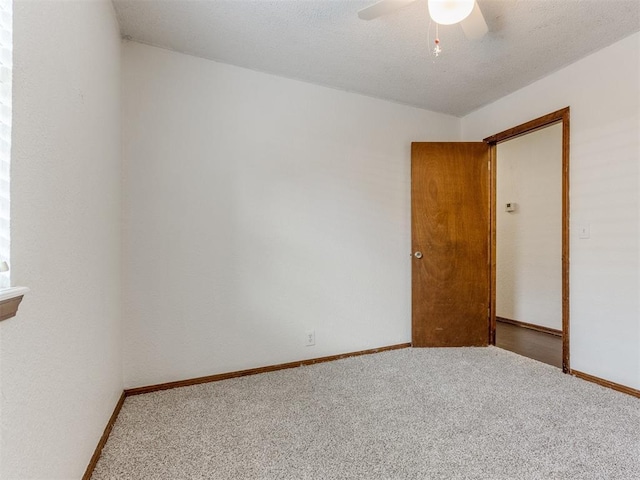 804 Royal Ln, Yukon, OK 73099 - carpeted spare room featuring ceiling fan and baseboards
