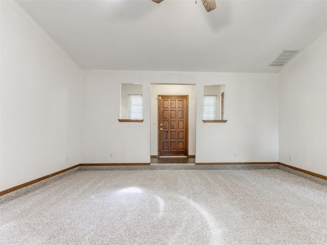 804 Royal Ln, Yukon, OK 73099 - empty room with plenty of natural light and ceiling fan
