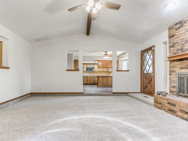 804 Royal Ln, Yukon, OK 73099 - unfurnished living room with a ceiling fan, carpet flooring, and a fireplace